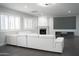 Living Room with fireplace, projector screen, and white sectional at 18860 N 73Rd Dr, Glendale, AZ 85308