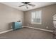 Bright and airy bedroom with a ceiling fan and shutters on the windows at 20539 W Terrace Ln, Buckeye, AZ 85396