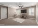 The bonus room offers a ceiling fan, plush carpeting and shuttered windows for privacy and natural light at 20539 W Terrace Ln, Buckeye, AZ 85396