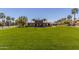 Expansive community center and picnic area set on a large green lawn, perfect for outdoor activities at 20539 W Terrace Ln, Buckeye, AZ 85396