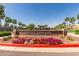 Beautiful community entrance featuring lush landscaping and decorative brick signage for Heritage Swim Park at 20539 W Terrace Ln, Buckeye, AZ 85396