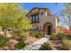 Charming two-story home with a well-manicured front yard and inviting arched entryway at 20539 W Terrace Ln, Buckeye, AZ 85396