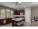 Stylish kitchen featuring an island with seating, stainless steel appliances, and ample cabinet space at 20539 W Terrace Ln, Buckeye, AZ 85396