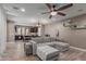 Spacious living room with a large sectional, ceiling fan, and open floor plan at 20539 W Terrace Ln, Buckeye, AZ 85396