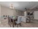 Open living space featuring a dining area, living room, and connection to the kitchen at 20539 W Terrace Ln, Buckeye, AZ 85396