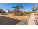 Fun and colorful playground area with climbing structures and slides, perfect for and families at 20539 W Terrace Ln, Buckeye, AZ 85396