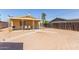 Cozy home with a spacious backyard, patio, and ample room for outdoor entertaining at 207 E Cedar Ave, Casa Grande, AZ 85122
