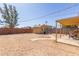 Desert landscaped backyard with covered patio and shed at 207 E Cedar Ave, Casa Grande, AZ 85122