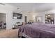Large bedroom is equipped with a big TV and storage and adjoins the kitchen at 207 E Cedar Ave, Casa Grande, AZ 85122