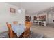 Cozy dining area with a wooden table and chairs, with a view into the kitchen at 21165 E Thornton Rd, Queen Creek, AZ 85142