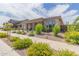 Beautiful home with desert landscaping and a covered entry way at 21165 E Thornton Rd, Queen Creek, AZ 85142
