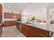 Spacious kitchen with granite countertops, stainless appliances and view of the dining room at 21165 E Thornton Rd, Queen Creek, AZ 85142