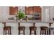 Kitchen with large island, granite countertop, stainless appliances, and seating for four at 21165 E Thornton Rd, Queen Creek, AZ 85142