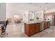 Bright kitchen with granite countertops, stainless appliances and view of dining area at 21165 E Thornton Rd, Queen Creek, AZ 85142