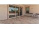 Covered patio with tile flooring, ceiling fan, and an outdoor seating area at 21165 E Thornton Rd, Queen Creek, AZ 85142
