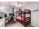 Cozy ' bedroom with bunkbeds, a ceiling fan and lots of natural light at 23830 W Chambers St, Buckeye, AZ 85326