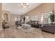 Spacious living room with vaulted ceilings, wood floors, and neutral decor at 23830 W Chambers St, Buckeye, AZ 85326