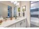 Elegant bathroom with a quartz countertop, contemporary fixtures, and decorative accents at 25751 S 227Th Way, Queen Creek, AZ 85142