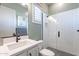 Modern bathroom with white subway tile shower, glass door, and white vanity offers a clean aesthetic at 25751 S 227Th Way, Queen Creek, AZ 85142