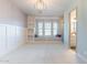 Charming bedroom featuring a window seat, modern light fixture, and an attached bathroom at 25751 S 227Th Way, Queen Creek, AZ 85142