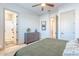 Comfortable bedroom featuring a dresser with decor and a connected bathroom entrance for easy accessibility at 25751 S 227Th Way, Queen Creek, AZ 85142