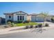 Lovely single-story home with a two-car garage, neatly trimmed lawn, and charming curb appeal at 25751 S 227Th Way, Queen Creek, AZ 85142