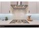 Bright kitchen featuring white cabinetry, stainless steel appliances and range at 25751 S 227Th Way, Queen Creek, AZ 85142