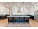 Modern kitchen featuring a large island, stainless steel appliances, pendant lighting and plenty of storage space at 25751 S 227Th Way, Queen Creek, AZ 85142