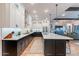 Spacious kitchen with open floor plan, featuring stainless steel appliances and large island at 25751 S 227Th Way, Queen Creek, AZ 85142