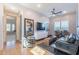 Inviting living room with wood floors, modern furnishings, and a ceiling fan at 25751 S 227Th Way, Queen Creek, AZ 85142