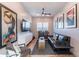 A charming living room with a decorative rug, comfortable seating, and stylish wall art at 25751 S 227Th Way, Queen Creek, AZ 85142