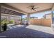 Spacious patio with ceiling fan, brick pavers, outdoor kitchen and bar seating with a built in grill at 25751 S 227Th Way, Queen Creek, AZ 85142