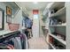 Organized walk-in closet with ample shelving and hanging space for clothing and accessories at 25751 S 227Th Way, Queen Creek, AZ 85142