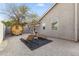 Private backyard retreat with gravel, lounge chairs, and a wooden sauna at 2906 E Nora St, Mesa, AZ 85213