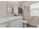 Bright bathroom featuring white vanity, elegant fixtures, and modern finishes at 2906 E Nora St, Mesa, AZ 85213