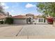 Charming single-story home featuring a well-maintained front yard and a spacious two-car garage at 2906 E Nora St, Mesa, AZ 85213
