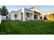 Spacious backyard featuring a modern patio, manicured lawn and stylish home exterior at 3019 E Redfield Rd, Phoenix, AZ 85032
