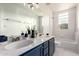 Bright bathroom featuring a double sink vanity, a bathtub and tile floor at 3019 E Redfield Rd, Phoenix, AZ 85032