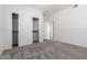 Bedroom with carpet floors, white walls, a window, and closet at 3019 E Redfield Rd, Phoenix, AZ 85032