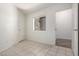 Bedroom featuring tile floor, white walls, and a window at 3019 E Redfield Rd, Phoenix, AZ 85032