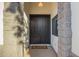 Close-up of home's welcoming double front door with a stone entryway and welcome mat at 3019 E Redfield Rd, Phoenix, AZ 85032