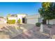 Charming single-story home with a two-car garage, desert landscaping, and a well-manicured lawn at 3019 E Redfield Rd, Phoenix, AZ 85032