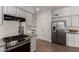 Open-concept kitchen with granite countertops, stainless steel appliances, and plenty of storage at 3019 E Redfield Rd, Phoenix, AZ 85032