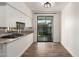 Bright kitchen with stainless steel appliances, granite countertops and access to the backyard at 3019 E Redfield Rd, Phoenix, AZ 85032