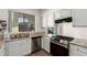 A close-up shot of the bright kitchen showcasing granite countertops and stainless steel appliances at 3019 E Redfield Rd, Phoenix, AZ 85032