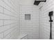 Modern shower with white subway tile, niche and bench seating at 3019 E Redfield Rd, Phoenix, AZ 85032