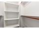 A walk-in closet featuring both shelving and a rod for hanging clothes at 3019 E Redfield Rd, Phoenix, AZ 85032