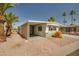 Well-maintained single-story home with covered parking, desert landscaping, and a welcoming entrance at 3104 E Broadway Rd -- # 287, Mesa, AZ 85204