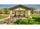 Exterior view of the community gazebo with picnic table at 3104 E Broadway Rd -- # 287, Mesa, AZ 85204
