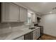 Updated kitchen with grey cabinets, modern appliances, and a bright window at 3104 E Broadway Rd -- # 287, Mesa, AZ 85204